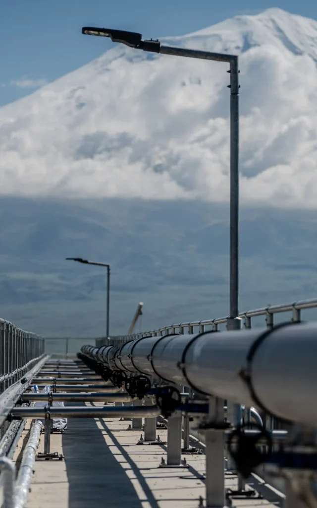 Pipeline walkway at a wastewater treatment facility in Doğubayazıt, with snow-capped Mount Ararat, in the background
