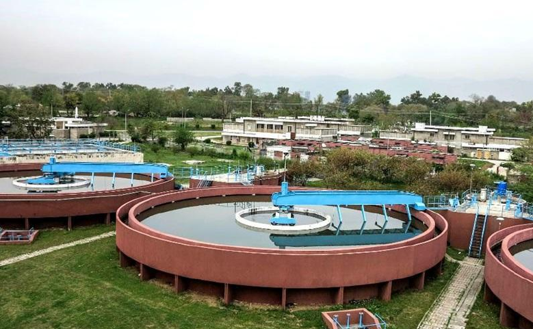 Circular settling tanks at a wastewater treatment plant in Punjab, Pakistan